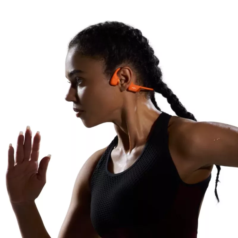 Słuchawki na przewodnictwo kostne Shokz OpenRun Pro 2 — binauralne, bezprzewodowe Bluetooth 5.3, IP55, 12 godz. odtwarzania, 150 mAh, pomarańczowe, zaczepiane na ucho