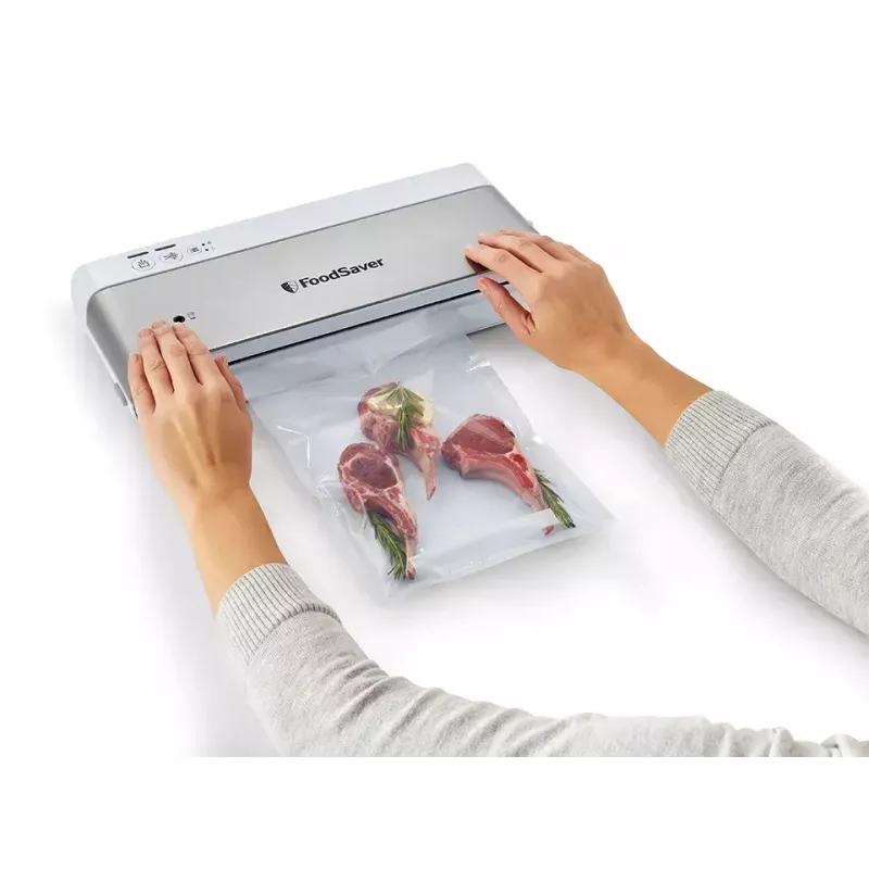 Zgrzewarka próżniowa FoodSaver VS0100X — sterowanie obrotowe, zawiera rolkę i 4 worki próżniowe, srebrno-biała
