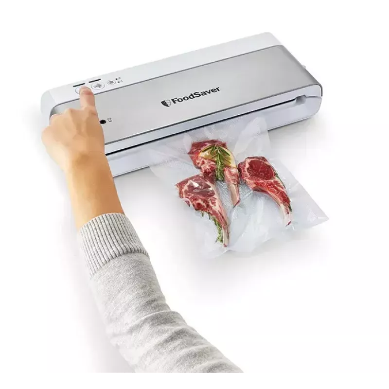 Zgrzewarka próżniowa FoodSaver VS0100X — sterowanie obrotowe, zawiera rolkę i 4 worki próżniowe, srebrno-biała