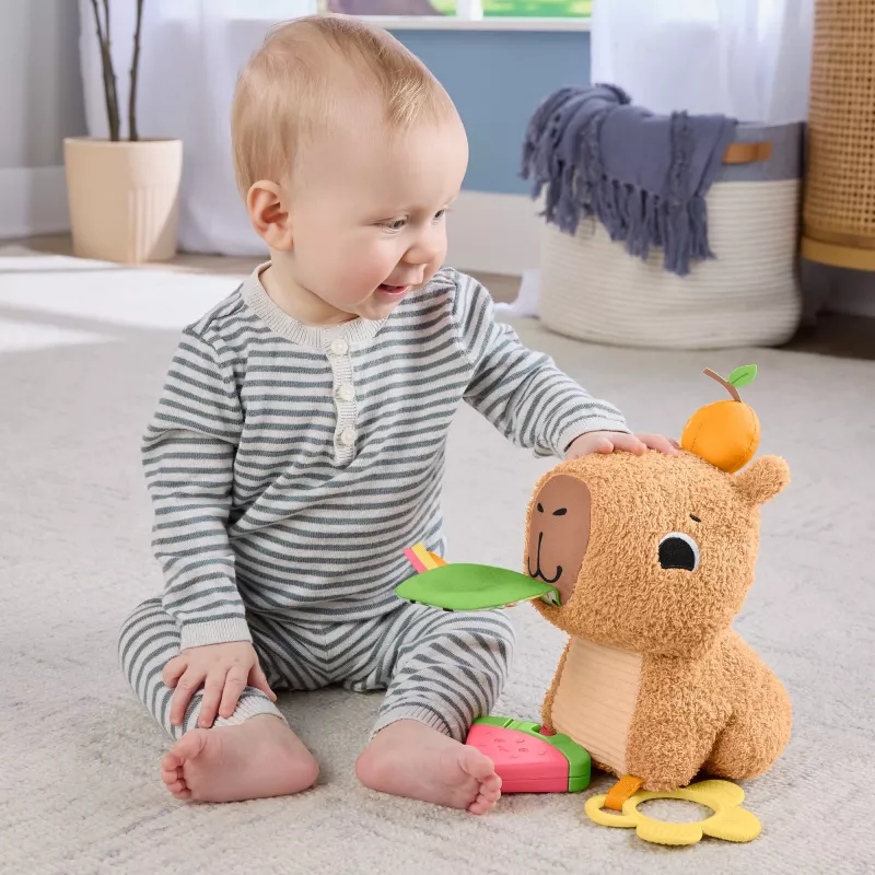 Zabawkowa kapibara Fisher-Price Snuggly Snacky Capy 0,5 roku