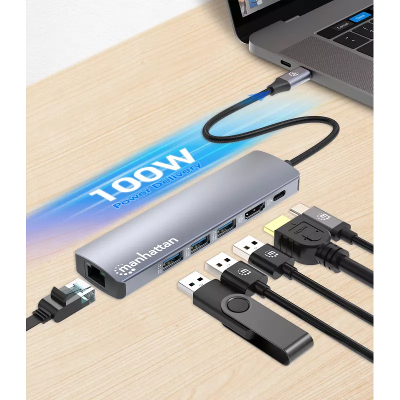 Manhattan USB-C Dock/Hub, Porty (x6): Ethernet, HDMI, USB-A (x3) i USB-C, z zasilaniem Power Delivery (PD) 100 W — wymaga zewnętrznej ładowarki USB-C (brak w zestawie). Zasilany przez USB (bez zewnętrznego zasilacza), gdy PD nie jest używany