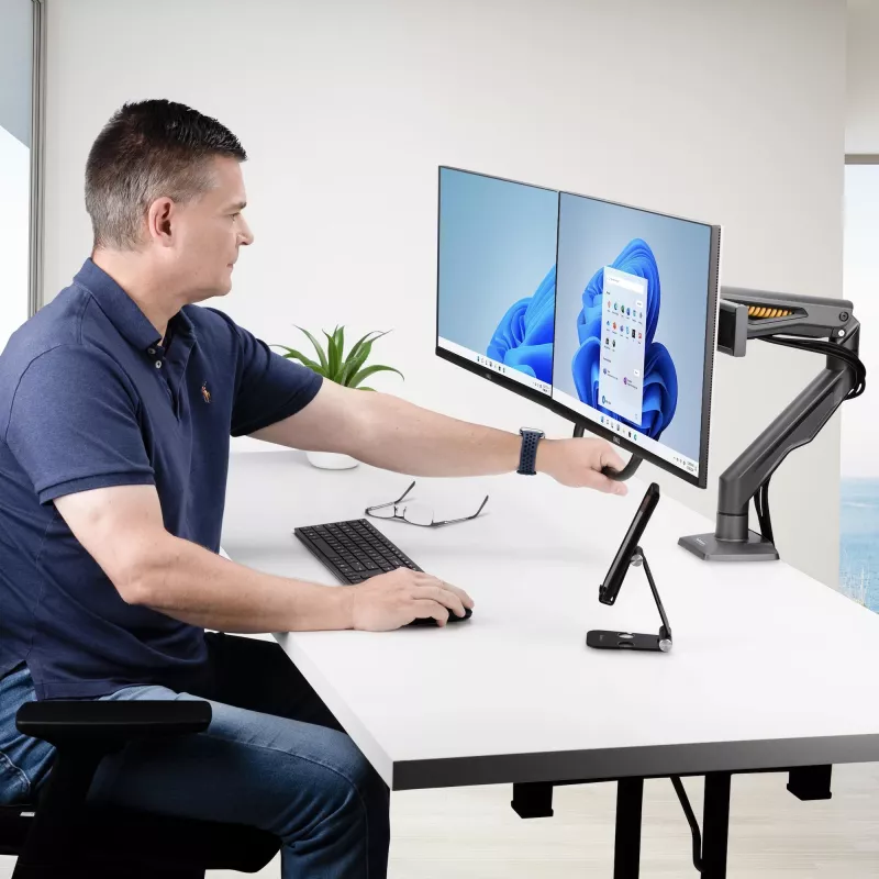 StarTech.com Dwupunktowe ramię do monitorów z poprzeczką, montaż do biurka, do monitorów do 27 cali, VESA 75x75/100x100, maks. 33 funty/15 kg, zacisk C, w pełni przegubowe, sprężyna mechaniczna, TAA
