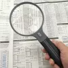 Szkło powiększające Carson Split Handle HF-11 — 3,5× ręczne szkło powiększające, czarny/przezroczysty, bateria AAA