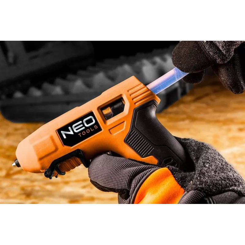 NEO Tools 17-083 Przewodowy pistolet do kleju na gorąco 20W z dyszą antykroplową, wkłady klejowe 11mm, zintegrowana podstawka, 230V, Pomarańczowy/Czarny